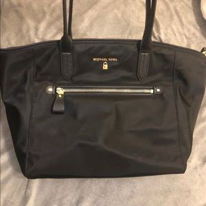 Black Michael Kors handbag.